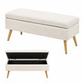 Panca contenitore imbottita in tessuto bouclé poliestere beige con struttura in MDF e gambe in legno massello 100 x 40 x 45 cm